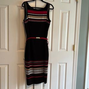 WHBM dress Never worn. Leather like around the sleeve